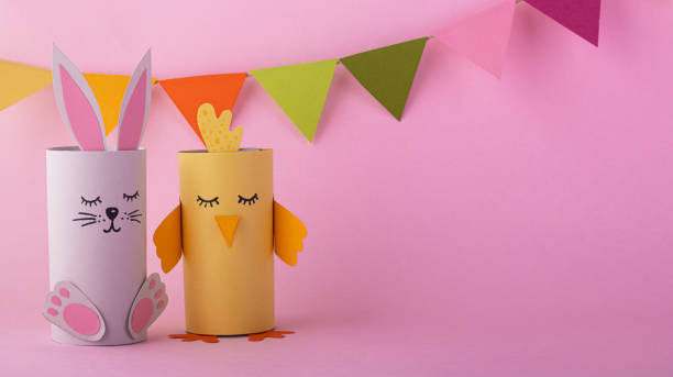 istock cute rabbit and bird handmade from paper 1296829398