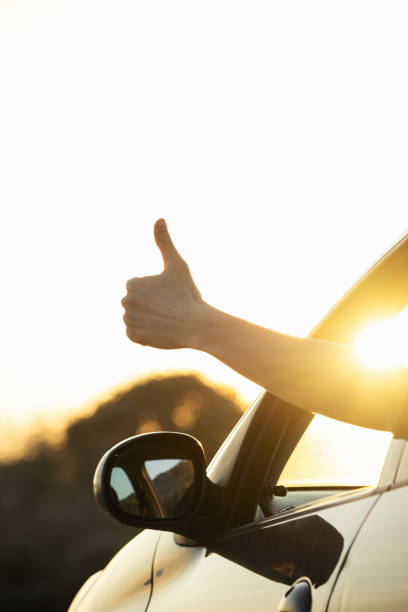 istock Driver's hand showing thumbs up. 1296832966