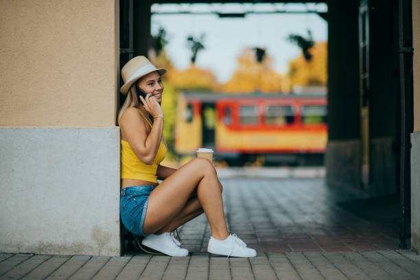 istock young girl waiting for the train in summer 1296834159