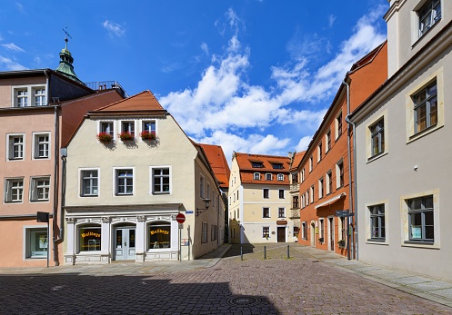 Pirna, Germany, July 26, 2020: View of a street in the center of the Saxon city of Pirna on a sunny summer day. The historic city center is beautifully renovated and definitely worth a visit.