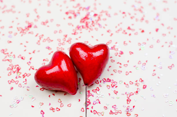 istock Red hearts on a beige background 1296834290