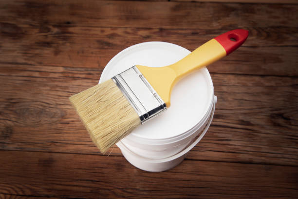 istock brush on the paint bowl 1296834415
