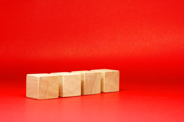 istock Mockup 4 wooden square block object on red background and copy space - Creative Word Editor Template 1296835540