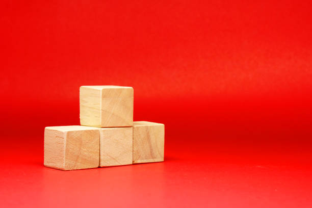 istock Mockup 4 wooden square block object on red background and copy space - Creative Word Editor Template 1296835672