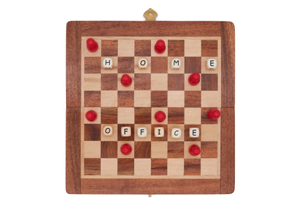 istock Red pawns work from home on a small chessboard and keep their distance 1296836713