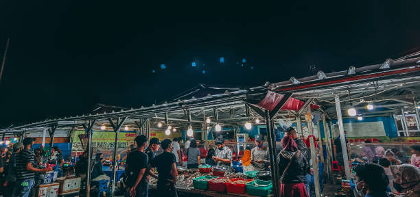 istock Ancol seafood market at night 1296838382