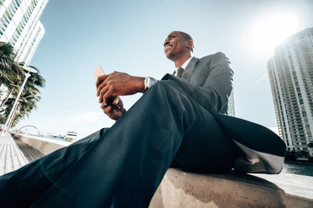 istock businessman make a phone call in miami 1296842513