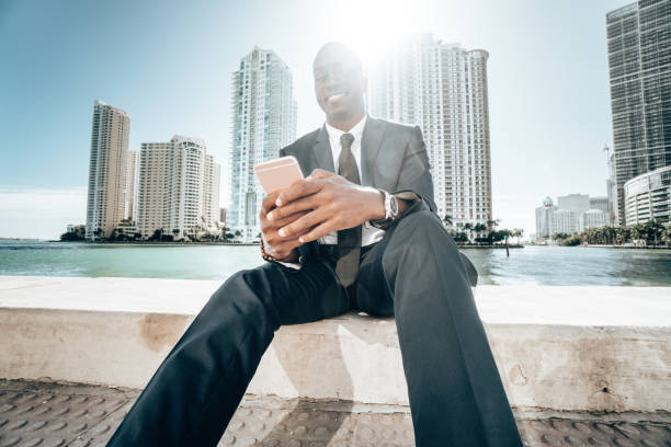 istock businessman make a phone call in miami 1296842591