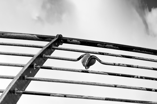 Black and white vertical image of sailboat hardware on a sailboat mast used on schooners on the Chesapeake Bay in Maryland