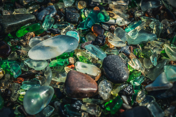 istock Natural background with sea glass close-up on sand. 1296854042