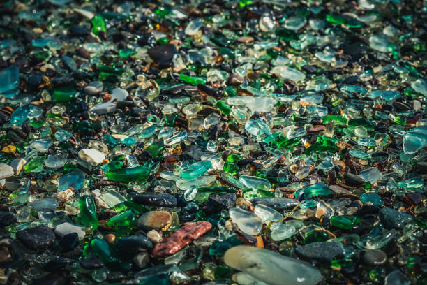 istock Natural background with sea glass close-up on sand. 1296854207