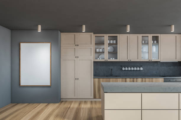 istock Gray kitchen interior with cupboards and poster 1296854417