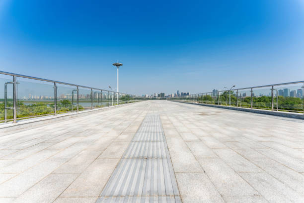istock empty, modern square and skyscrapers in modern city 1296854782