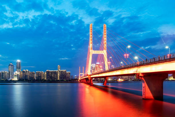istock Modern bridge in the city at night 1296855891