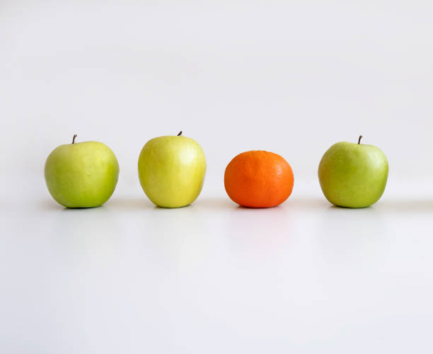 istock apple and mandarin. Different brand mean 1296858441