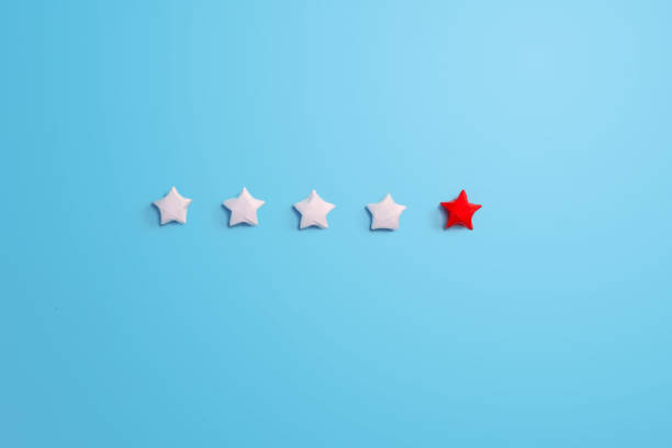 istock Star of customer satisfaction on blue background 1296861993