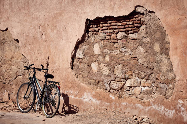 istock Old Bicycle at a Broken Wall, Delhi 1296862628