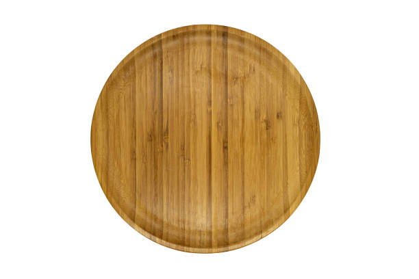 istock Empty bamboo wooden brown plate isolated on white 1296863087