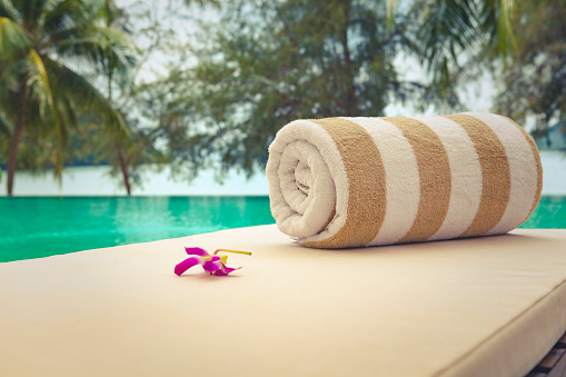 towel and tropical flower in tourist resort in malaysia.