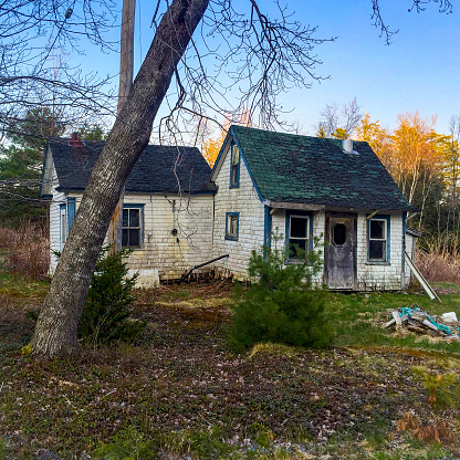 An abandoned house in Canada, in a fall-setting, taken near Pleasantville, NS on May 9th, 2016.