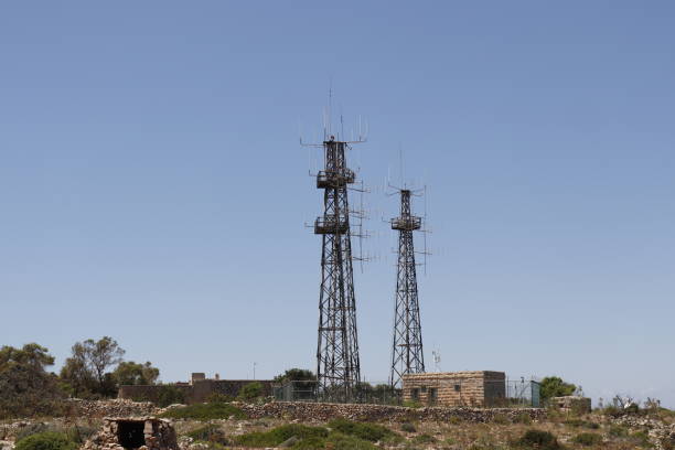 istock simple antenna mast with antennas to receive signals. 1296867510