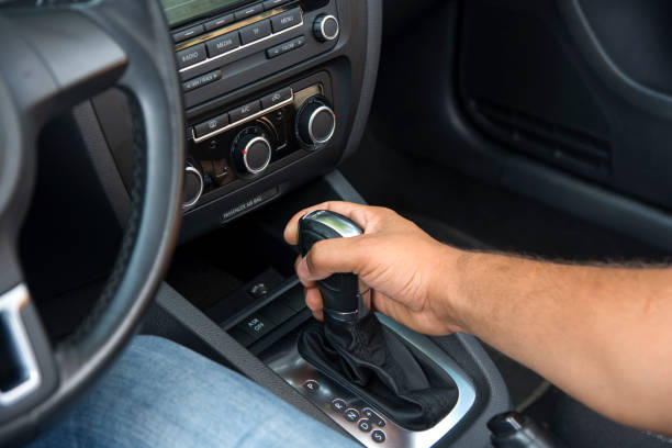 hand on gearshift stick stock photo hand on gearshift stick stock photo automatic stock pictures, royalty-free photos & images