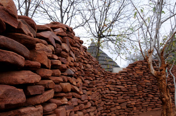 istock An ancient hand-packed stone wall forming a barrier against danger 1296871133
