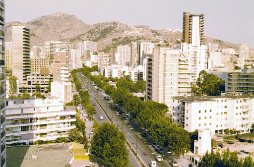 Benidorm, Spain, July 1980. Analog vintage atmospheric view of the city of Benidorm with hotels highrise, Spain in the early 1980s
