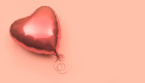 istock One red heart shaped air balloon on pink background with place for text 1296875724