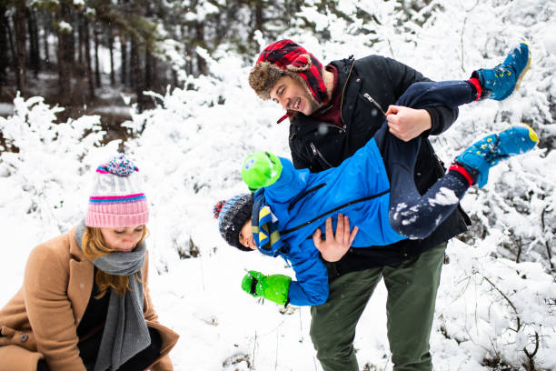 istock A family having fun in the snow 1296878425