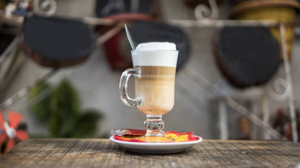 coffee latte is on the wooden table focus foreground horizontal photo