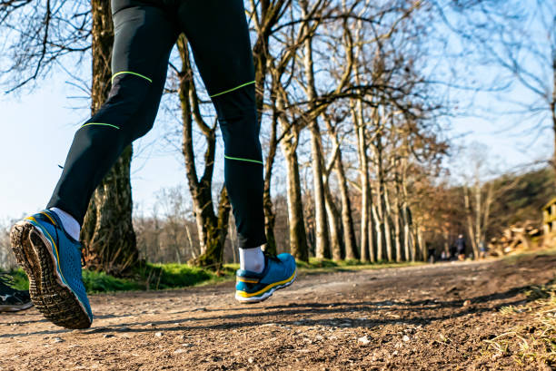 istock Jogging scene in a public park 1296880641
