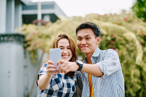 istock Beautiful Couple Taking Selfie Together During Summer 1296880660