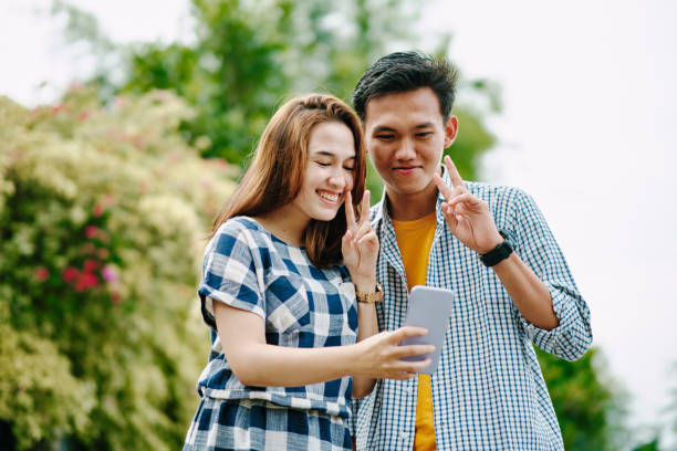 istock Beautiful Couple Taking Selfie Together During Summer 1296880877