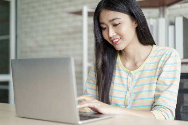 istock Young woman working from home office 1296881475