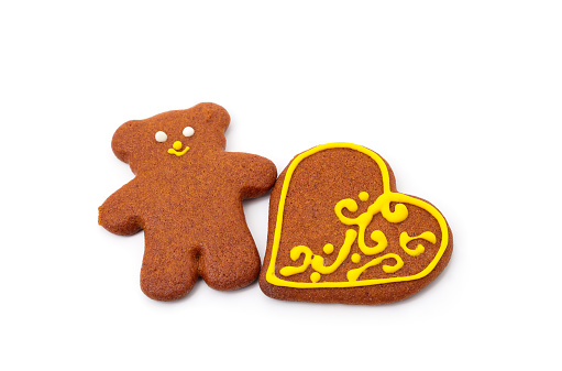 Gingerbread ginger bear and heart isolated on a white background.
