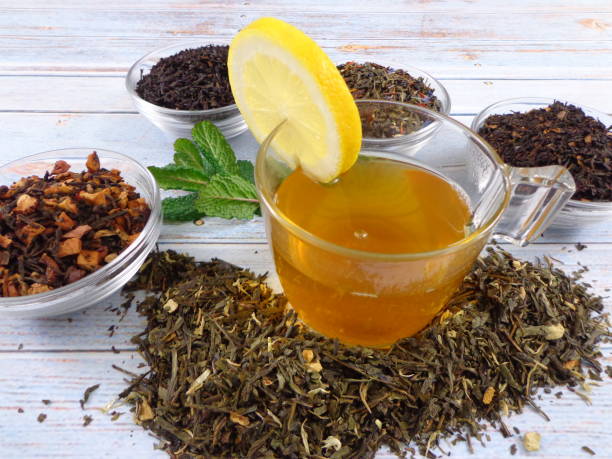 istock Green tea cup with a lemon wedge and mint leaves 1296889910
