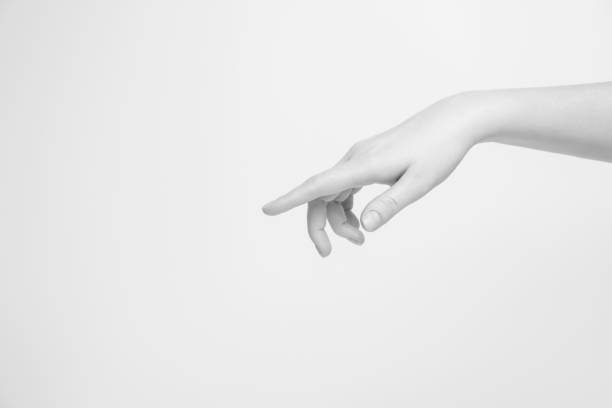 istock Women's hand shows a finger to the side. 1296891185