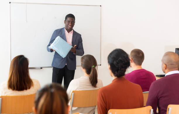 istock An entrepreneur advertises product at business training 1296898974