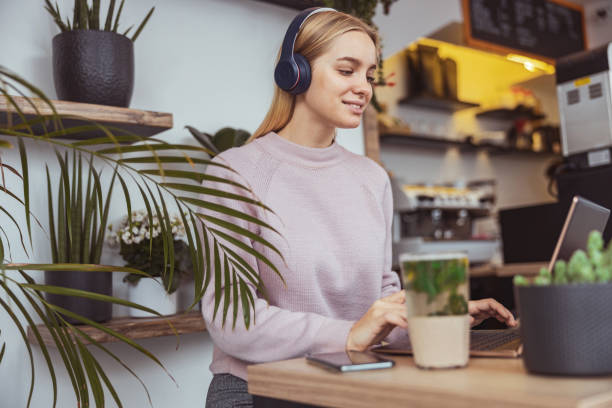istock Young blond lady working in cafe and walking in city 1296899250