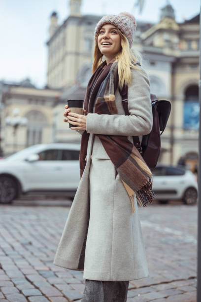 istock Young blond lady working in cafe and walking in city 1296899360