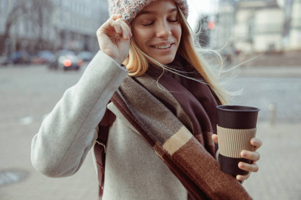 istock Young blond lady working in cafe and walking in city 1296899393