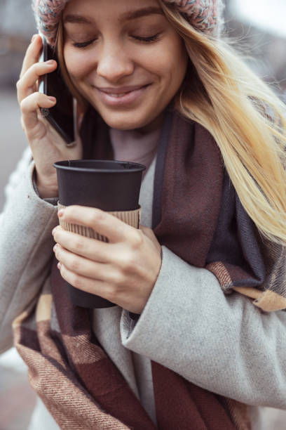 istock Young blond lady working in cafe and walking in city 1296899424