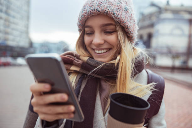 istock Young blond lady working in cafe and walking in city 1296899443