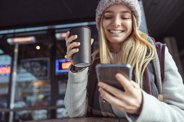 istock Young blond lady working in cafe and walking in city 1296899502