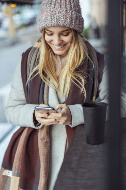 istock Young blond lady working in cafe and walking in city 1296899558