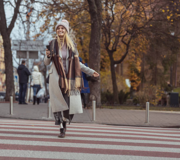 istock Young blond lady working in cafe and walking in city 1296899559