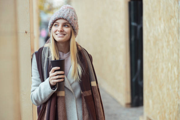 istock Young blond lady working in cafe and walking in city 1296899575