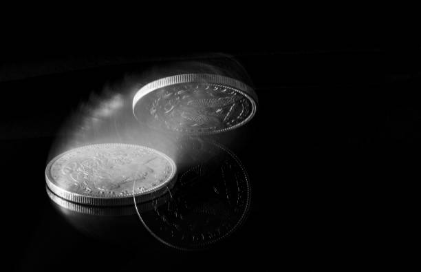 istock Dollar coin spinning to rest 1296901770