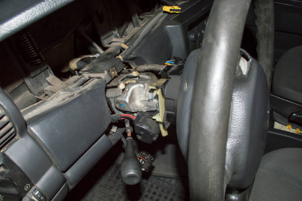 istock The interior of the car with a disassembled steering column 1296902029